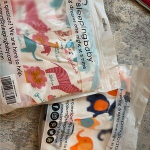 2 new size M sleeping baby zipadee sleep suits- 6-12 months